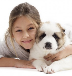 child and puppy